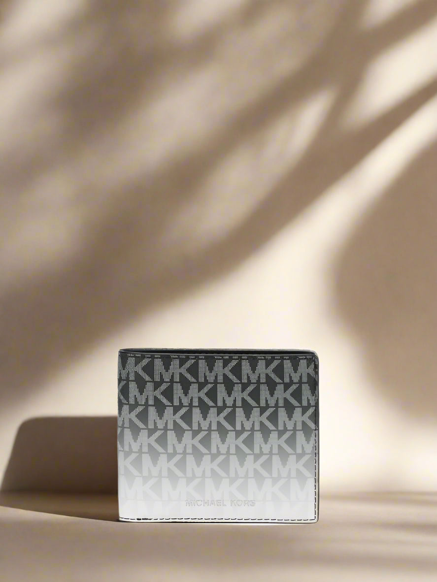 Cardholder with MK monogram pattern on a white background