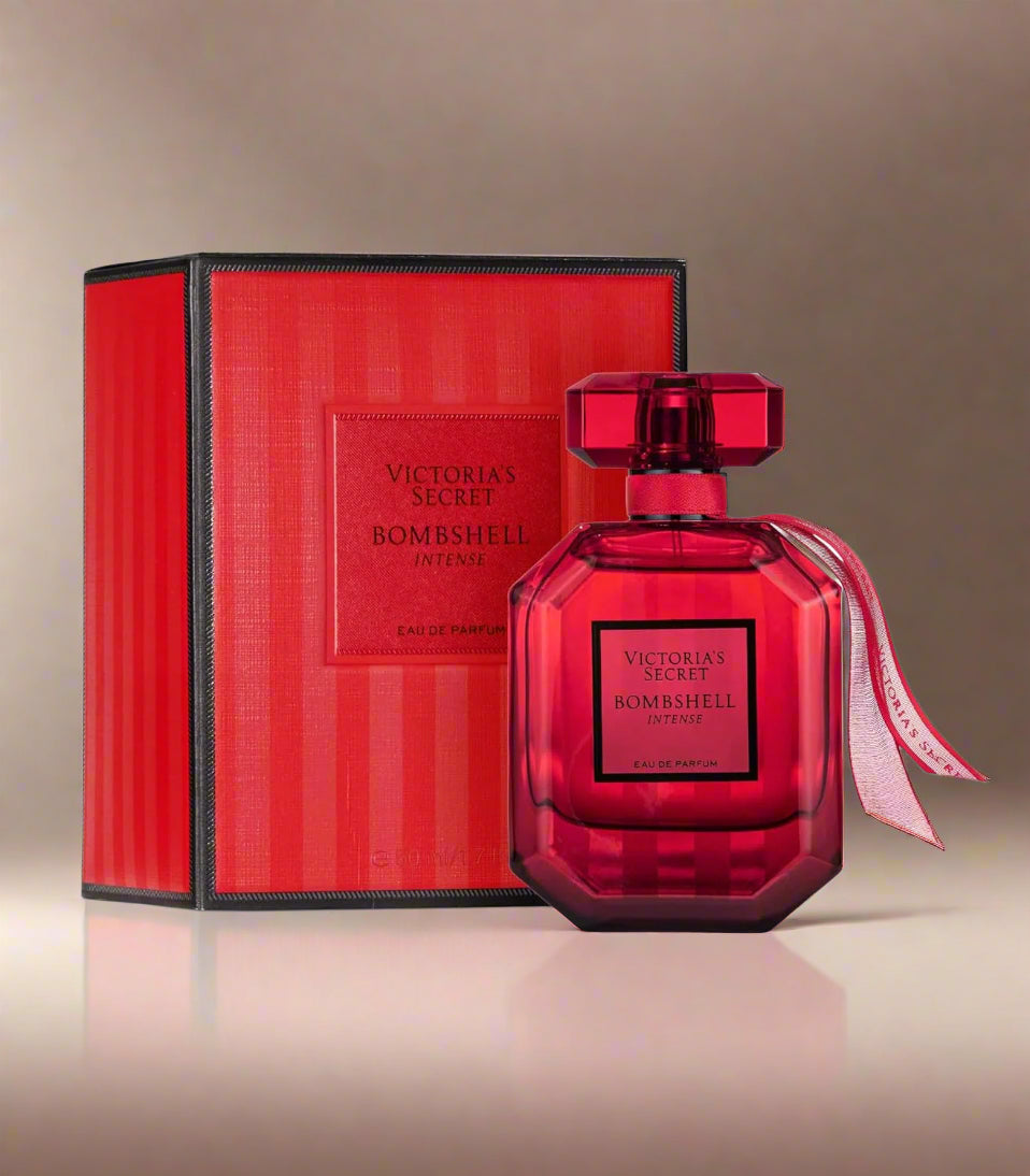 Red Victoria's Secret Bombshell Intense perfume bottle and packaging on a white background